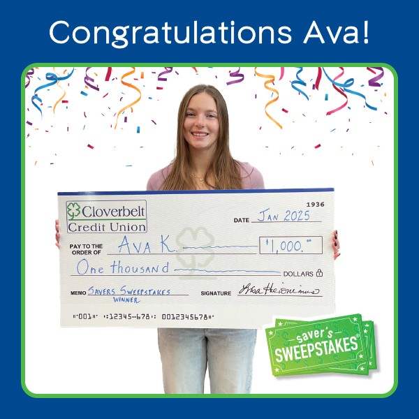 Ava K. Holding $1,000 Check for winning the quarterly saver's sweepstakes drawing.