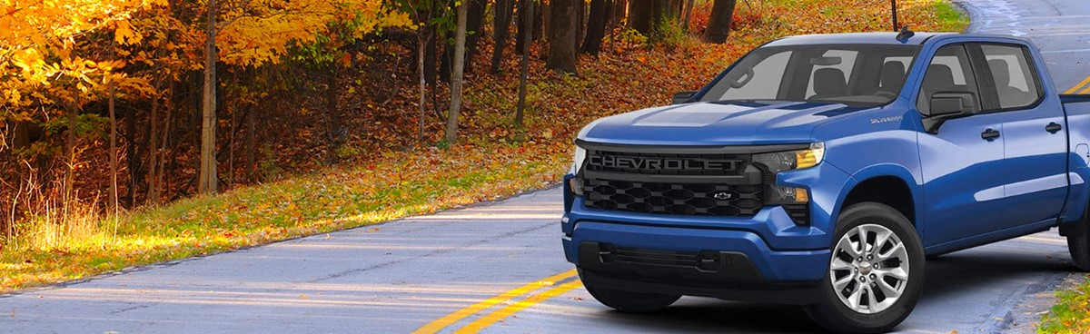 Blue chevy truck with fall colors